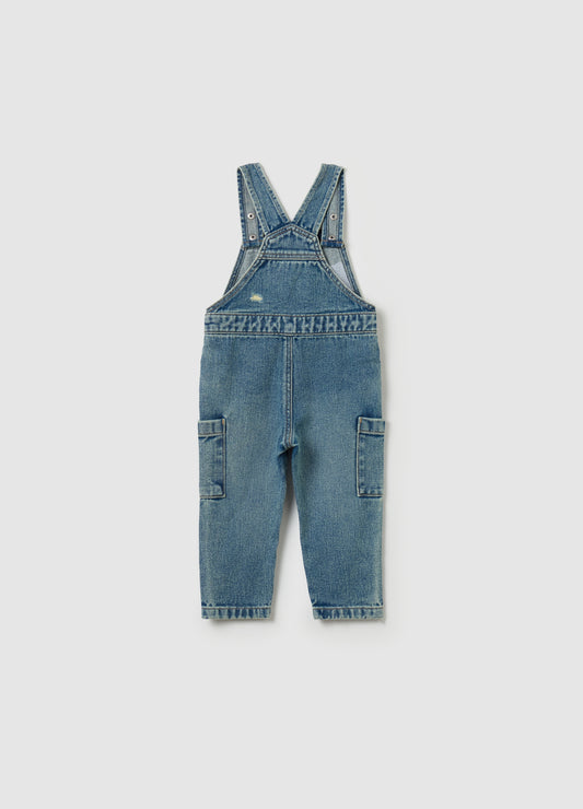 Denim dungarees with abrasions